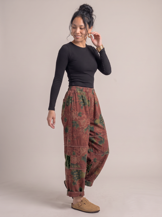 Greta Rose Print Barrel Pants in Rust Rose, three-quarter view
